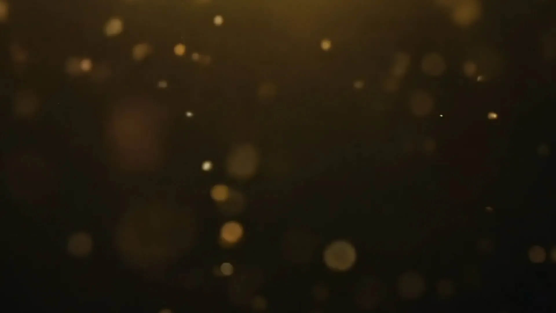 Golden Bokeh Particle Overlay for Motion Video Projects